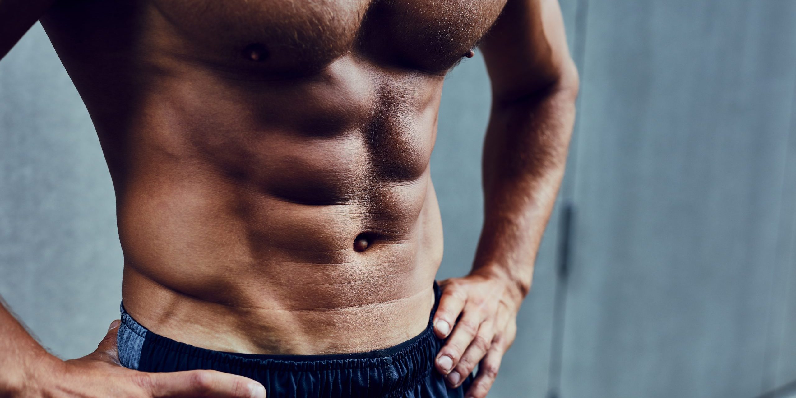 Close,Shot,Of,Athletic,Well,Built,Man,With,Six,Pack Supplement Powders