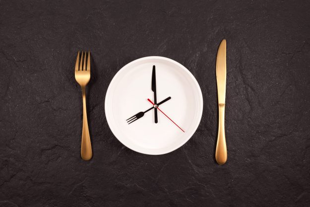 Clock,Hands,On,A,White,Plate.,Gold,Fork,And,Knife autophagy