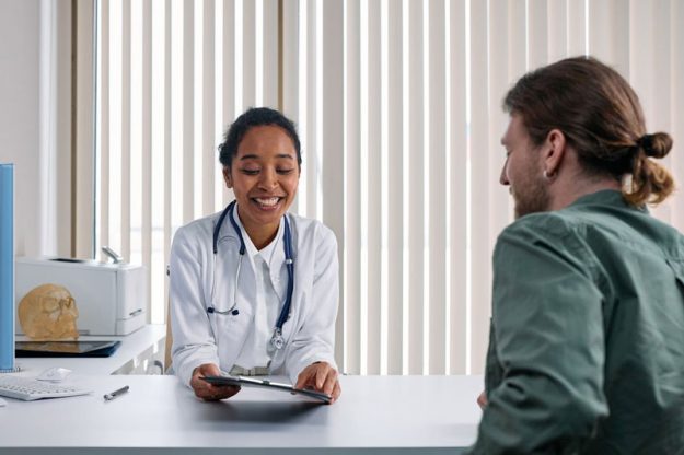 A-Doctor-Talking-with-the-Patient Internal Medicine Doctor