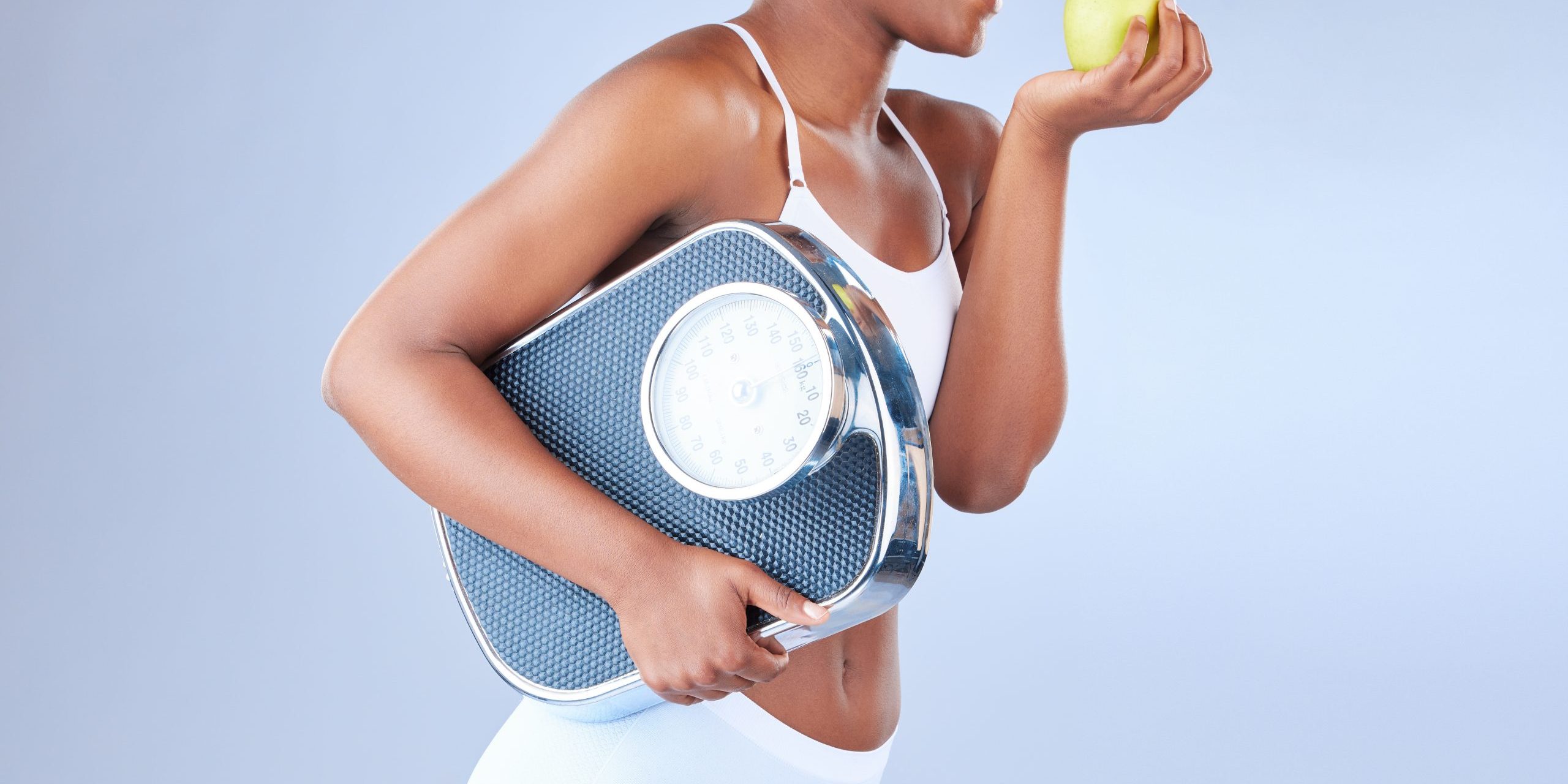 studio-shot-of-a-young-woman-eating-an-apple-and-h-2023-11-27-04-51-48-utc weight loss clinics in miami