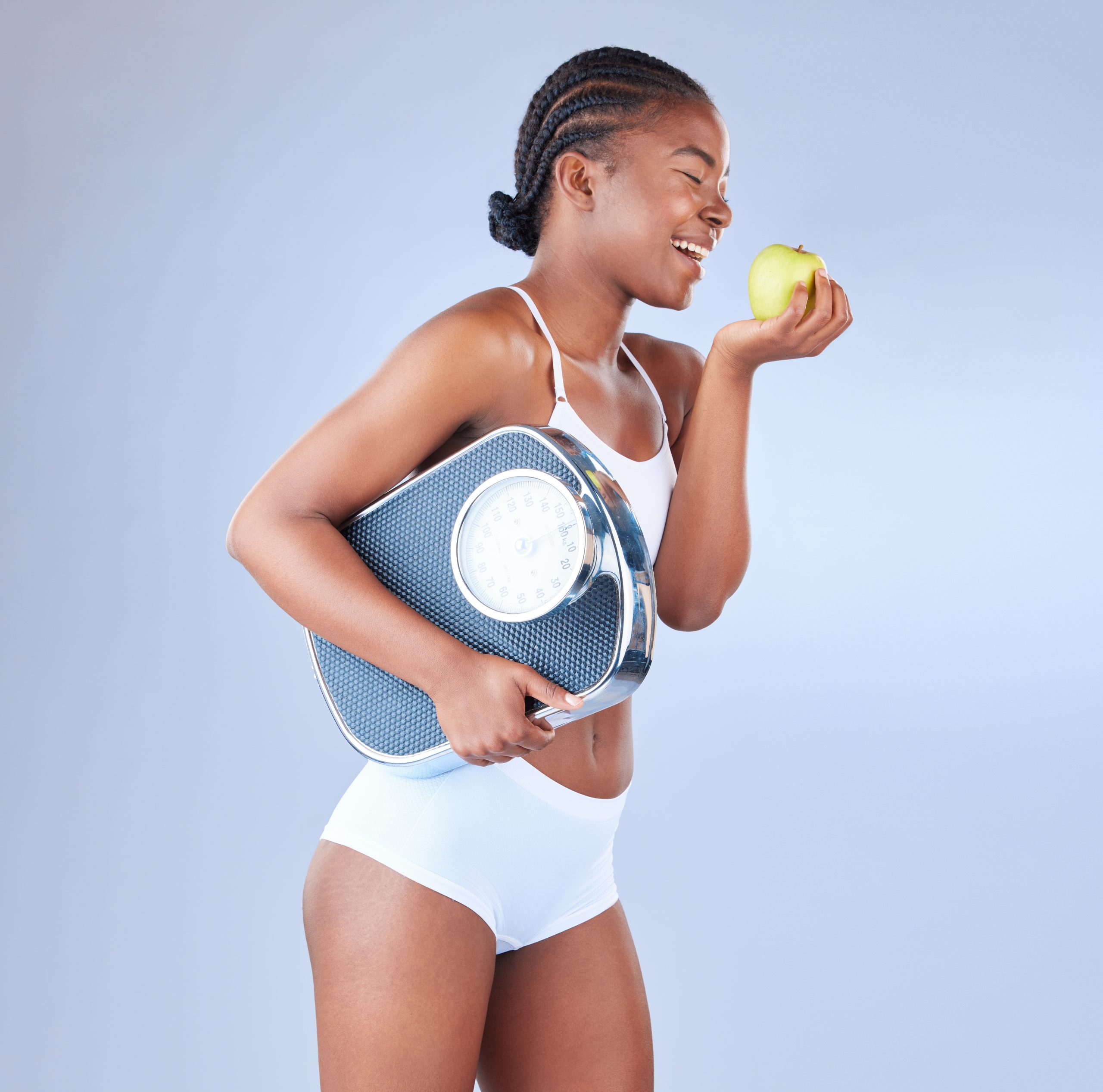 studio-shot-of-a-young-woman-eating-an-apple-and-h-2023-11-27-04-51-48-utc weight loss clinics in miami
