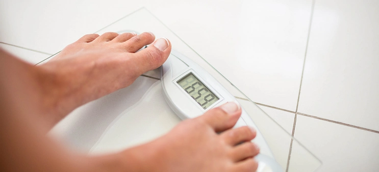 woman standing on scales