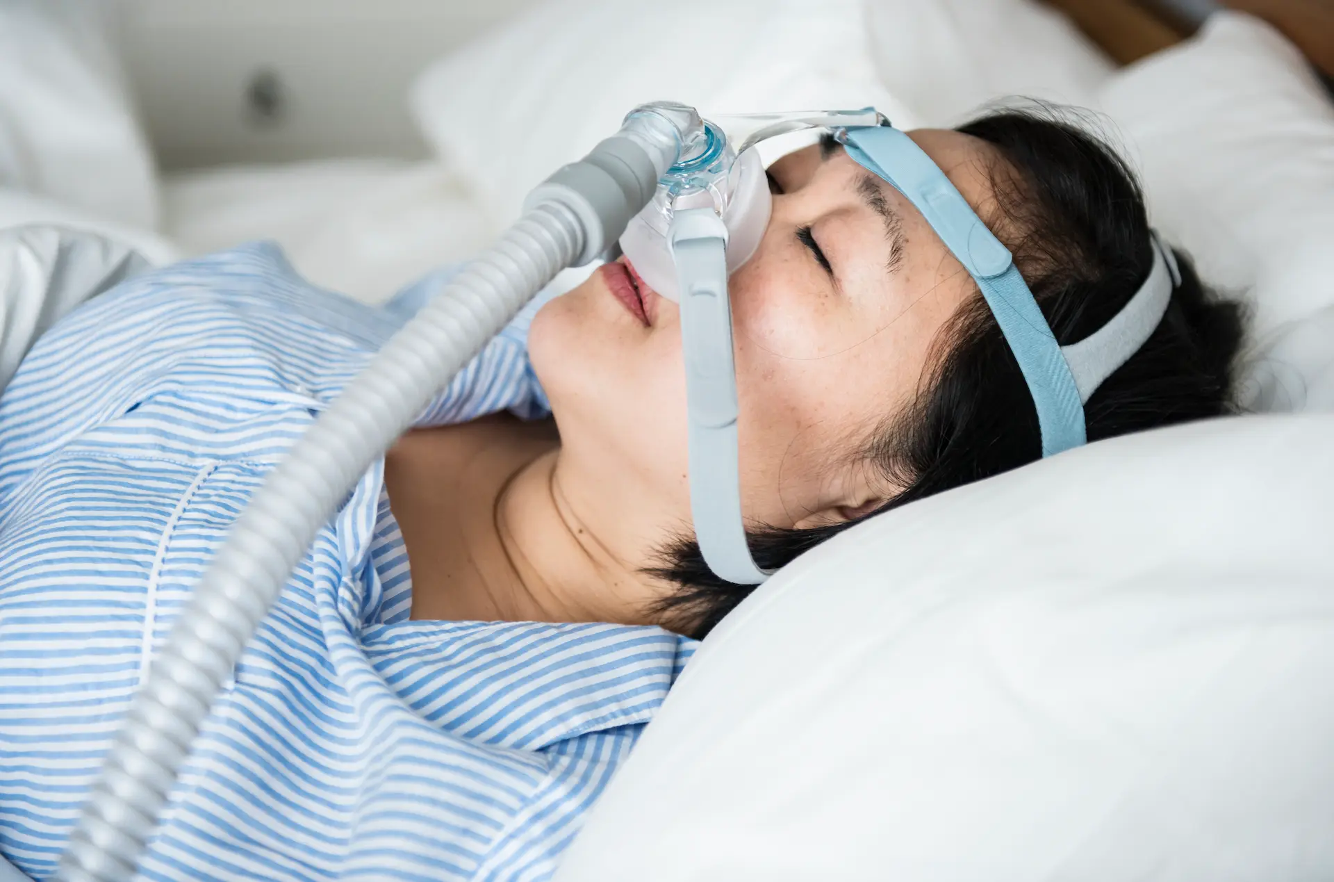 woman wearing anti-snoring chin straps